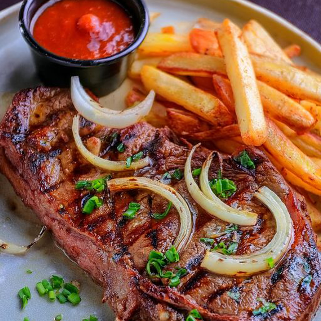 RIBEYE STEAK WITH FRENCH ONIONS AND FRENCH FRIES